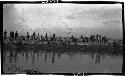 People gathered along a riverbank