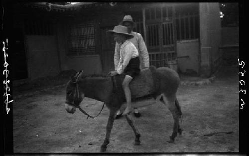 Child riding pony