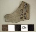 Rectangular palette small fragment. raised border with row of transverse grooves