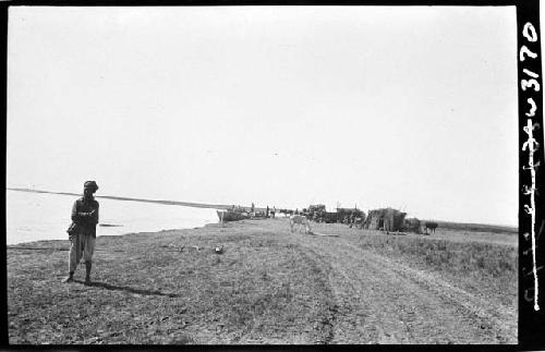 Person stands in field