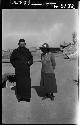 Fr. Schram Louis standing with Janet Elliott Wulsin