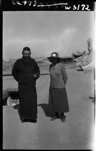 Fr. Schram Louis standing with Janet Elliott Wulsin