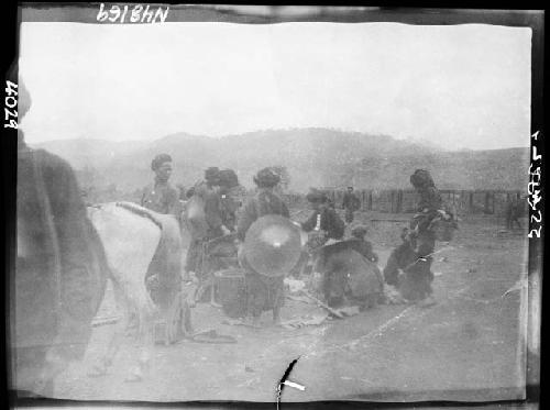 People with baskets and tools gathered outside