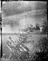 Canoes lined up along riverbank