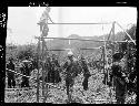 Workers construct building frame