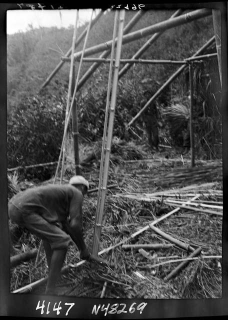 Worker constructs frame of building