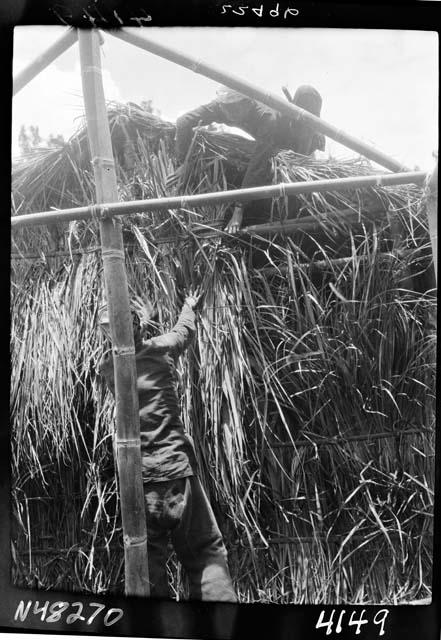 Worker constructs frame of building