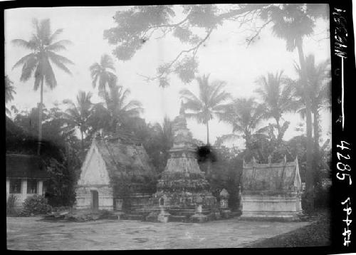 Three small, decorative buildings