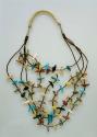 Necklace, 4 strands of tortoise shell beads with total of 64 carved animal fetis