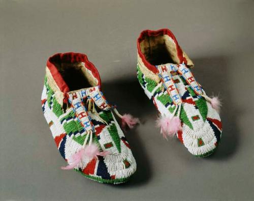 Pair of moccasins--beaded all over, including soles.