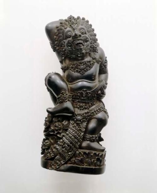 Ironwood carving of Boeta Sari, the bad god who became a good god +