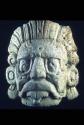 Sun god mask with filed teeth in mouth