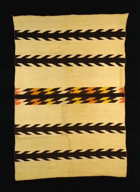 Banded blanket or rug. Central band formed by stacked lozenges