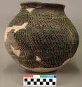 Ceramic jar, corrugated, heavily reconstructed
