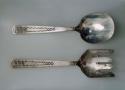 Silver salad servers, stamp designs on the bowls of the spoon & fork & the handl
