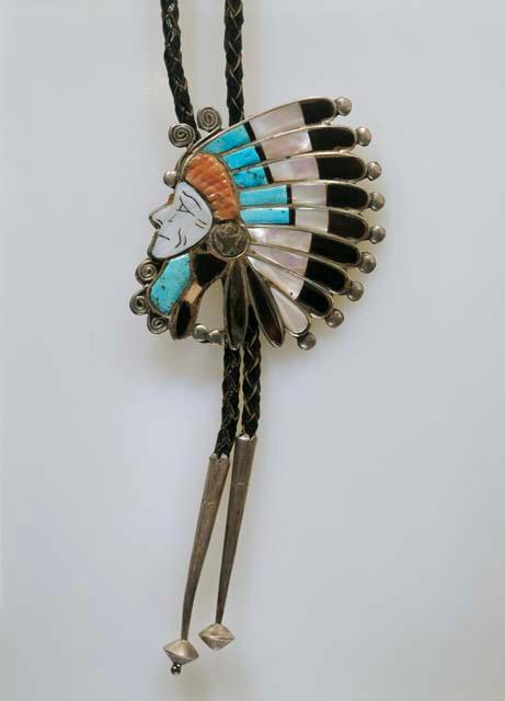 Bolo, Indian head with feather headdress inlaid with different materials