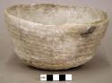 Ceramic bowl, slightly corrugated, flat base