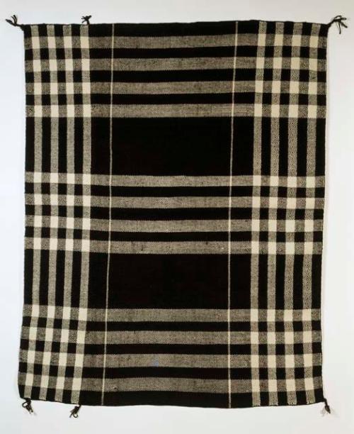 Black and white plaid wool manta (man's blanket)