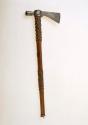 Pipe tomahawk. Head cast from one piece, handle decorated w/ brass tacks