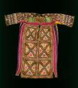 Dress; heavily embroidred/ornamented.