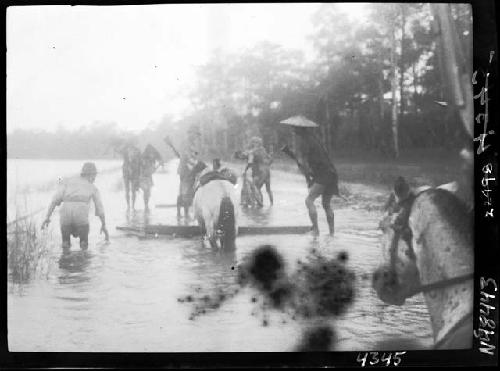 People gathered in shallow water