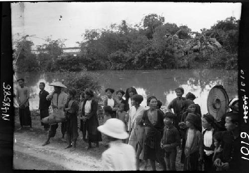 Group lined up along river