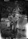 Man in uniform standing by rocks