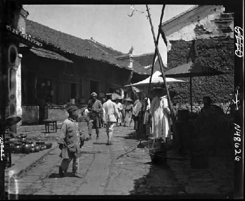 People walking down road