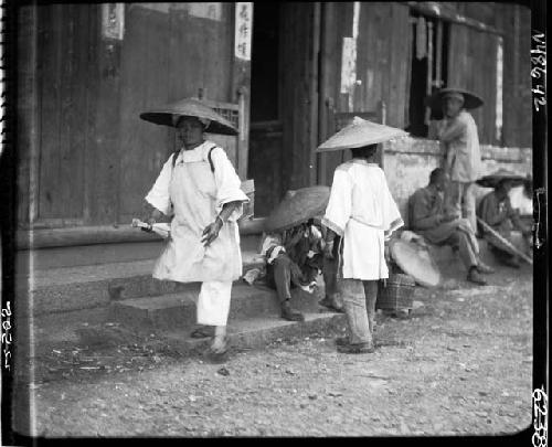 Children walk outside building