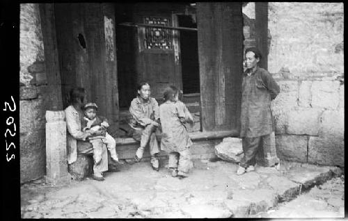 Small group gathered outside building