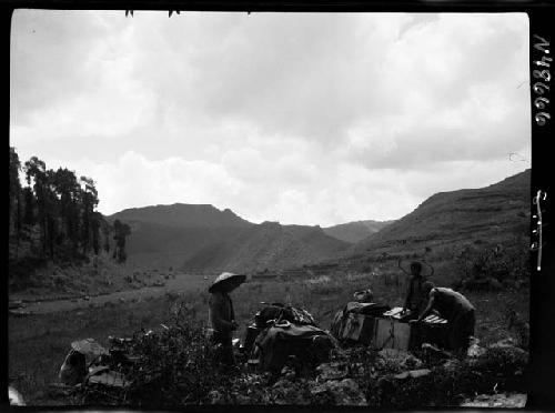 People and cargo in field