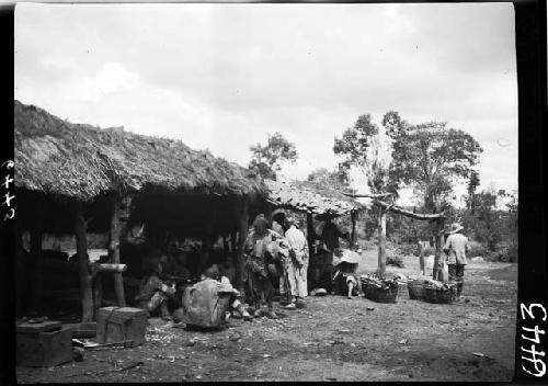 People in and around open-air structure