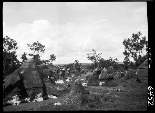 People walk among rock formations