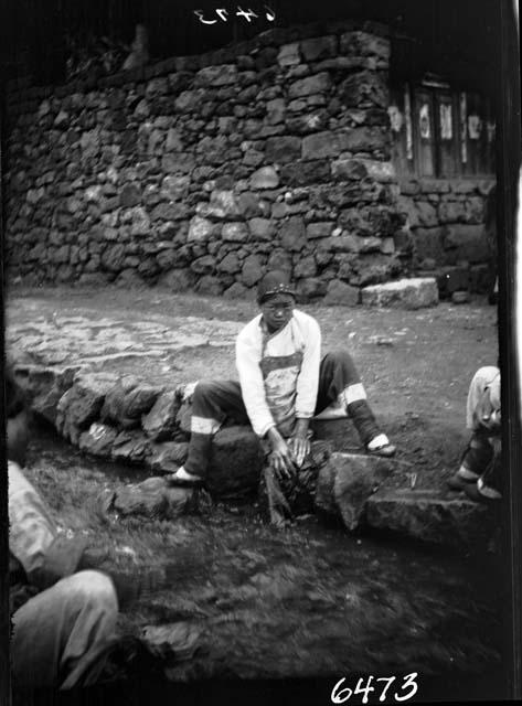 Child works along stream