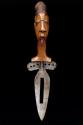 Metal knife with carved wooden head image
