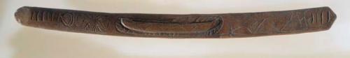 Carving, carved wood stick, incised curvilinear design, one end broken