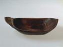 Dish, carved wood, ovate with pointed ends, flat base, incised rim
