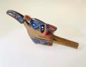 Wooden rattle carved and painted with totemic design