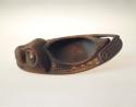 Cedar bowl in shape of seal, inlaid w/ shell, beads, & beads.