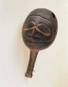 Haida cedar shaman's rattle. Both sides of rattle are carved in shape of a hawk.