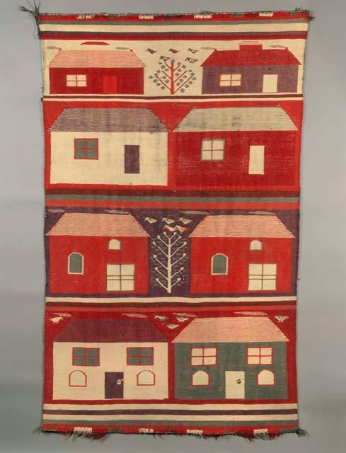 Germantown pictorial rug with four bands, each with two houses in various colors