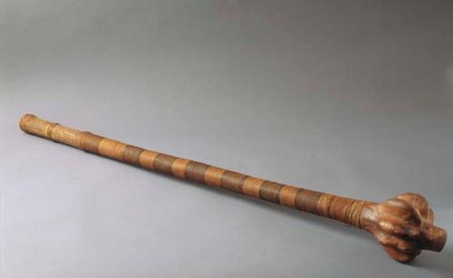 Club, carved wood, fiber wrapped and carved handle, globular head