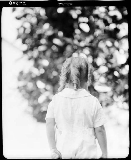 Child standing outside