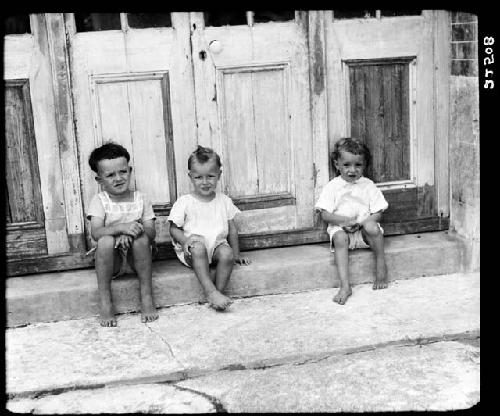 Children sitting on step