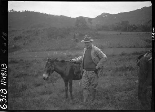 Man standing with horse