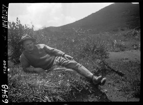 Man reclining on ground