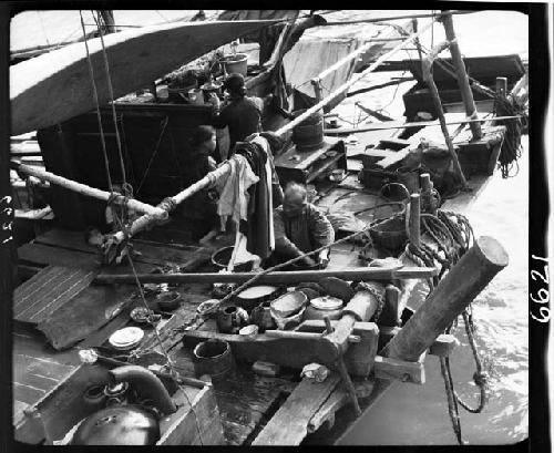 People working aboard boat