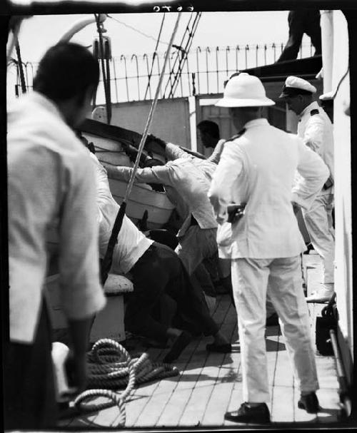 People working on board boat