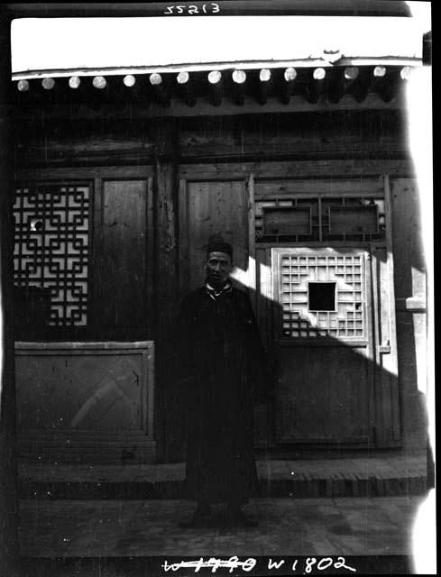 Man stands in front of building