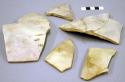 Ceramic sherds, plain with traces of brown slip design on exterior, mended